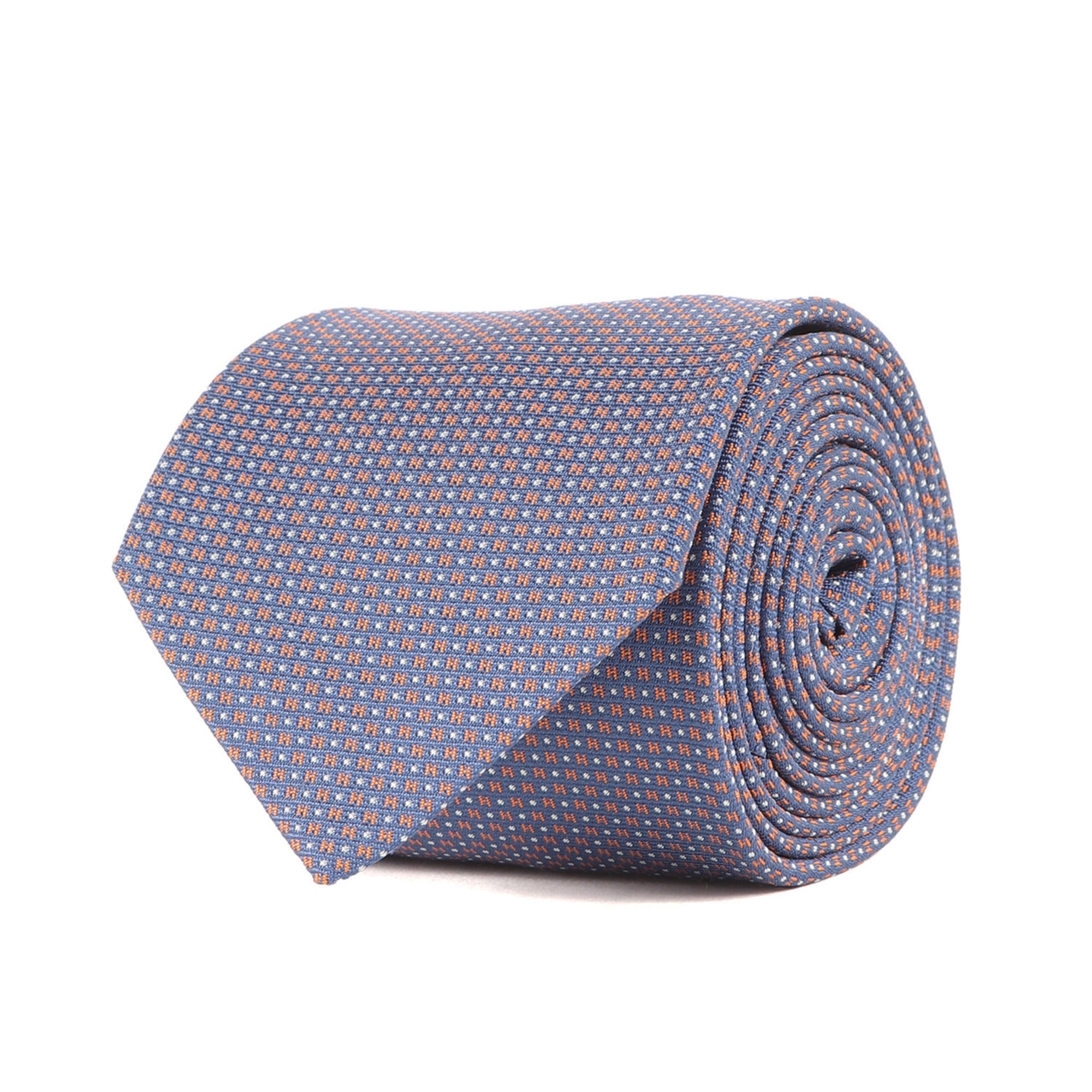 HERMES Mega Chariot H-patterned silk tie (339098T) featuring a three-dimensional horse mane design in navy and orange. Like new. K4615.