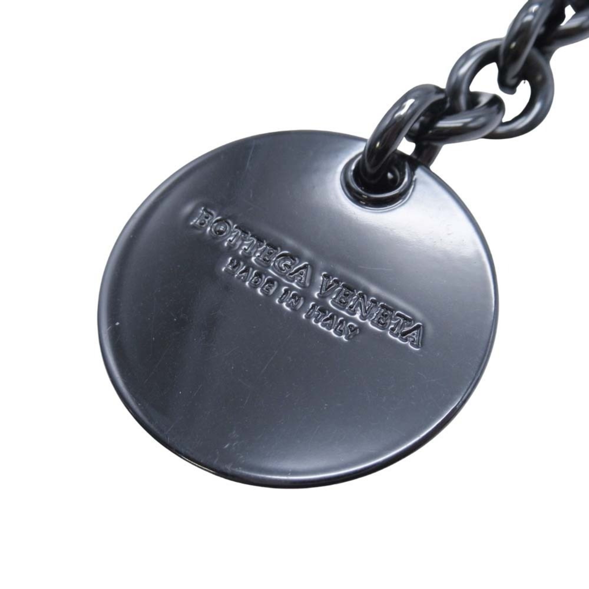 BOTTEGA VENETA Bottega Veneta metal chain belt with logo, papillon, and coin motif in black for men women.