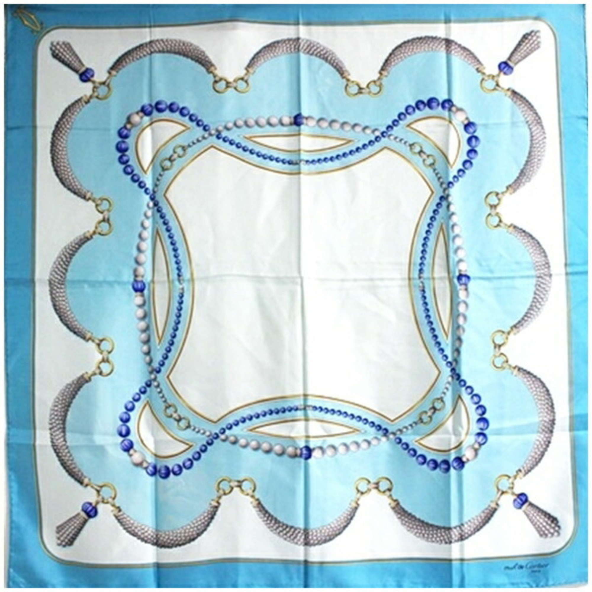 Cartier Must de silk scarf/muffler in light blue with a pattern for women